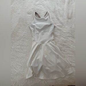 lululemon Court Crush Dress in White with a brown-toned built-in liner.